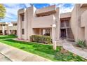 Attractive condo building with landscaping and walkway at 1920 W Lindner Ave # 130, Mesa, AZ 85202