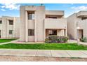 Condo building exterior, showcasing landscaping and walkway at 1920 W Lindner Ave # 130, Mesa, AZ 85202