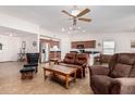 Spacious living room with leather furniture and a view into the kitchen at 2101 S Meridian Rd # 268, Apache Junction, AZ 85120
