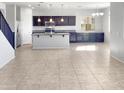 Open concept kitchen with island and modern cabinetry at 26520 N 132Nd Ln, Peoria, AZ 85383