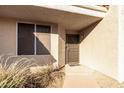 Condo entrance with security door and landscaping at 2929 W Yorkshire Dr # 1060, Phoenix, AZ 85027