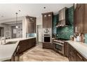 Modern kitchen featuring stainless steel appliances and a stylish backsplash at 4119 S Las Villa Way, Gold Canyon, AZ 85118