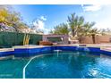 Resort-style pool and spa with a unique water feature at 4119 S Las Villa Way, Gold Canyon, AZ 85118