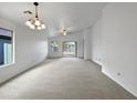 Spacious living area with access to the backyard and lots of natural light at 41876 W Corvalis Ln, Maricopa, AZ 85138