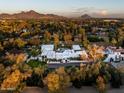Aerial view of a luxurious home with a pool and mountain views at 6617 N Central Ave, Phoenix, AZ 85012