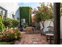 Charming courtyard with a fountain, seating area, and lush greenery at 6617 N Central Ave, Phoenix, AZ 85012