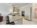 Modern kitchen with a breakfast bar and stainless steel appliances at 7180 E Kierland Blvd # 1209, Scottsdale, AZ 85254