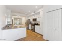 Open kitchen boasting granite counters and stainless steel appliances at 8653 E Royal Palm Rd # 2014, Scottsdale, AZ 85258