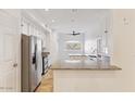 Bright kitchen featuring granite countertops and white cabinets at 8653 E Royal Palm Rd # 2014, Scottsdale, AZ 85258