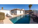 Inviting backyard pool with a slide and patio area at 10873 W Carlota Ln, Peoria, AZ 85373