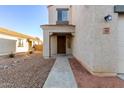 Front entrance with walkway and drought-tolerant landscaping at 1311 E Kelsi Ave, San Tan Valley, AZ 85140