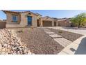 Landscaped front yard with a brick pathway at 16221 S 35Th Dr, Phoenix, AZ 85045