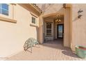 Ornate front door and a welcoming sitting area at 16221 S 35Th Dr, Phoenix, AZ 85045