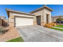 Exterior view of a house with a two-car garage at 23094 E Calle De Flores --, Queen Creek, AZ 85142