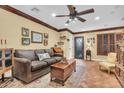 Spacious living room featuring hardwood floors and comfortable seating at 2458 E Roma Ave, Phoenix, AZ 85016