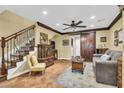 Open living area with hardwood floors, stylish furnishings, and a staircase at 2458 E Roma Ave, Phoenix, AZ 85016
