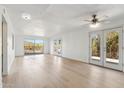 Living room with light wood floors and access to a patio at 5428 E El Sendero Dr, Cave Creek, AZ 85331