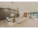 Open living space with a view of the pool and kitchen at 5825 E Cochise Rd, Paradise Valley, AZ 85253