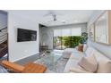 Bright living room with a plush sofa and scenic window views at 6990 E 6Th St # 1005, Scottsdale, AZ 85251