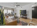 Living room with a comfortable couch and stylish wall decor at 7625 E Camelback Rd # A108, Scottsdale, AZ 85251