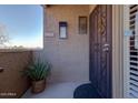 Front entrance with wrought iron door and potted plant at 7950 E Starlight Way # 220, Scottsdale, AZ 85250