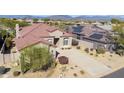 One-story home with tile roof, solar panels, and desert landscaping at 9514 E Cavalry Dr, Scottsdale, AZ 85262