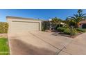 Mid-century modern home with a landscaped front yard at 1412 E Commodore Pl, Tempe, AZ 85283