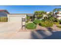 Mid-century modern home with a landscaped front yard at 1412 E Commodore Pl, Tempe, AZ 85283