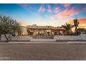 Elegant home showcasing a beautiful pool and desert landscape at 14236 E Ranch Rd, Scottsdale, AZ 85262
