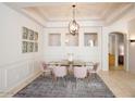 Elegant dining room with chandelier and glass-top table at 15720 E Yucca Dr, Fountain Hills, AZ 85268