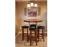 Charming breakfast nook with round table and four stools at 1720 E Thunderbird Rd # 2059, Phoenix, AZ 85022