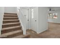 Carpeted staircase with a simple white railing leading to the upper level at 21150 W Prospector Way, Buckeye, AZ 85396