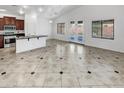 Kitchen with an island, stainless steel appliances, and dark wood cabinets at 3305 S 122Nd Ln, Tolleson, AZ 85353