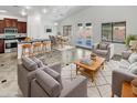 Open concept living area with kitchen, dining, and seating areas at 3305 S 122Nd Ln, Tolleson, AZ 85353