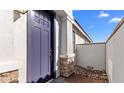 Close up of the stylish front door with stone accents at 4419 N 203Rd Ave, Buckeye, AZ 85396