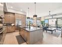 Modern kitchen with large island, stainless steel appliances, and ample cabinetry at 5250 E Deer Valley Dr # 450, Phoenix, AZ 85054
