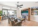 Living room with wood floors, fireplace, and access to balcony at 5250 E Deer Valley Dr # 450, Phoenix, AZ 85054