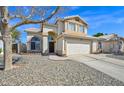 Charming two-story home boasting desert landscaping, a two-car garage, and great curb appeal at 659 S Dodge St, Gilbert, AZ 85233