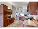 Spacious kitchen with stainless steel appliances and wood cabinets at 8749 E Willetta St, Scottsdale, AZ 85257