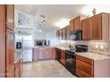 Kitchen features stainless steel refrigerator and wood cabinetry at 8749 E Willetta St, Scottsdale, AZ 85257
