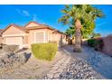 House exterior with landscaped yard and walkway at 8903 N 57Th Dr, Glendale, AZ 85302