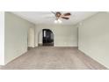 Bright living area with neutral walls and carpeting, offering a formal entryway at 1449 W Mohawk Ln, Phoenix, AZ 85027