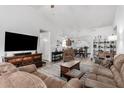 Open living room with a view into the kitchen and dining area at 18208 W Skyline Dr, Surprise, AZ 85374