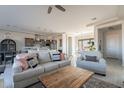 Bright and airy living room with sectional sofa and kitchen views at 24271 N 194Th Ave, Surprise, AZ 85387