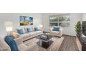 Bright living room featuring light beige sofas and a coffee table at 2609 S Country Club Way, Tempe, AZ 85282