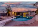 Inviting kidney-shaped pool with diving board and fenced backyard at 2609 S Country Club Way, Tempe, AZ 85282