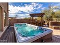 Inviting backyard features an in-ground spa and a bar top, perfect for entertaining at 2838 E Shady Spring Trl, Phoenix, AZ 85024