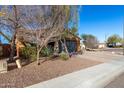 House exterior view, showing landscaping and a paved driveway at 31310 N 26Th Dr, Phoenix, AZ 85085