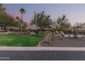 Stunning home exterior at dusk, showcasing landscaping at 4605 E Orange Dr, Phoenix, AZ 85018