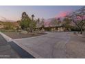 Home exterior with a long driveway and mountain view at 4605 E Orange Dr, Phoenix, AZ 85018